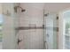 Elegant glass enclosed shower with white tile and dual showerheads at 310 Medridge Dr, Alpharetta, GA 30022