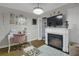 This bedroom offers a decorative fireplace, a ceiling fan, and a stylish desk at 314 3Rd Ne St # 4, Atlanta, GA 30308