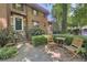 Charming brick condo featuring a landscaped entryway with stairs, patio seating, and inviting curb appeal at 314 3Rd Ne St # 4, Atlanta, GA 30308