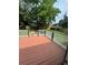 Backyard features a wooden deck, privacy fence, and ample space for outdoor activities at 1340 Stoneleigh Way, Stone Mountain, GA 30088