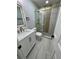 Remodeled bathroom with new sink, shower, and vanity at 1340 Stoneleigh Way, Stone Mountain, GA 30088