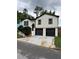 Beautiful two-story home featuring a fresh exterior paint, new windows, and a two car garage at 1340 Stoneleigh Way, Stone Mountain, GA 30088