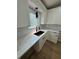 Modern kitchen with white cabinets, quartz countertops, undermount sink, and subway tile backsplash at 1340 Stoneleigh Way, Stone Mountain, GA 30088