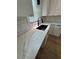 Well-equipped kitchen features white cabinets, marble backsplash, and a modern sink at 1340 Stoneleigh Way, Stone Mountain, GA 30088