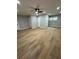 Spacious living room featuring laminate floors, a ceiling fan, and recessed lighting at 1340 Stoneleigh Way, Stone Mountain, GA 30088