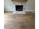 Living space with a marble fireplace and hearth, enhanced by new laminate flooring at 1340 Stoneleigh Way, Stone Mountain, GA 30088