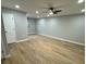 Spacious living room with recessed lights and ceiling fan, showcasing new laminate floors at 1340 Stoneleigh Way, Stone Mountain, GA 30088