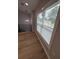 Well-lit room featuring a large window and modern railings, complemented by new floors at 1340 Stoneleigh Way, Stone Mountain, GA 30088