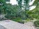 Backyard featuring a golf cart and a view of the surrounding greenery, with a wooden deck in the foreground at 1467 Shiloh Trail East Nw, Kennesaw, GA 30144