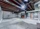 Basement space with exposed ceiling beams and a fireplace at 1467 Shiloh Trail East Nw, Kennesaw, GA 30144