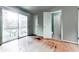 Bedroom featuring glass sliding doors, closet, ensuite bathroom and hardwood floors at 1467 Shiloh Trail East Nw, Kennesaw, GA 30144