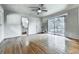 Spacious bedroom features hardwood floors, ceiling fan, and ensuite bathroom at 1467 Shiloh Trail East Nw, Kennesaw, GA 30144