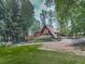 A-frame home boasts a lush lawn, mature trees and a winding driveway for a secluded feel at 1467 Shiloh Trail East Nw, Kennesaw, GA 30144