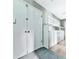 Hallway featuring storage cabinets and doors with wood flooring and view to other rooms at 1467 Shiloh Trail East Nw, Kennesaw, GA 30144
