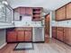 Galley kitchen offering updated stainless steel appliances, wood cabinets and durable floors at 1467 Shiloh Trail East Nw, Kennesaw, GA 30144