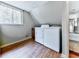 Functional laundry area featuring a washer, dryer, and natural light from the window at 1467 Shiloh Trail East Nw, Kennesaw, GA 30144