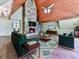 Spacious living room with stone fireplace, spiral staircase, and wood ceiling at 1467 Shiloh Trail East Nw, Kennesaw, GA 30144
