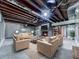 Cozy finished basement living room with exposed ceiling, brick fireplace, and comfortable seating at 1467 Shiloh Trail East Nw, Kennesaw, GA 30144