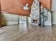Living room featuring fireplace, spiral staircase, wood ceilings, and views to outdoors at 1467 Shiloh Trail East Nw, Kennesaw, GA 30144
