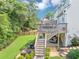 Multi-level backyard with a deck, patio, and lush landscaping, ideal for outdoor entertaining and relaxation at 1487 Monarch Ct, Marietta, GA 30062