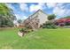 Beautifully landscaped backyard with a spacious lawn, a cozy patio area, and mature trees for added privacy at 1487 Monarch Ct, Marietta, GA 30062