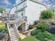 Multi-level backyard featuring a deck, patio, stone steps, and lush landscaping, ideal for outdoor enjoyment at 1487 Monarch Ct, Marietta, GA 30062