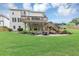 Large backyard features a patio with outdoor seating, perfect for gatherings and enjoying the beautiful landscaping at 1487 Monarch Ct, Marietta, GA 30062