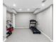 Finished basement with a treadmill, neutral walls, and recessed lighting at 1487 Monarch Ct, Marietta, GA 30062