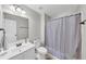 Bright bathroom with shower-tub combo, neutral color scheme, and modern vanity at 1487 Monarch Ct, Marietta, GA 30062