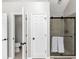 Bathroom features a walk-in shower with glass door, tile surround, and a nearby water closet at 1487 Monarch Ct, Marietta, GA 30062