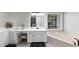 Bright bathroom with double sink vanity, makeup vanity, and soaking tub by a window at 1487 Monarch Ct, Marietta, GA 30062