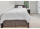 Bright bedroom featuring a twin bed with white bedding and a dark wood headboard at 1487 Monarch Ct, Marietta, GA 30062