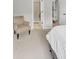 Cozy bedroom features a chair, a neutral color scheme, and an en suite bathroom at 1487 Monarch Ct, Marietta, GA 30062