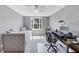 Bedroom setup as a home office with a daybed, modern desk, and a ceiling fan at 1487 Monarch Ct, Marietta, GA 30062