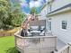 Spacious deck with outdoor seating, a grill, and a cantilevered umbrella, perfect for entertaining and relaxing at 1487 Monarch Ct, Marietta, GA 30062