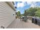 Wooden deck with patio furniture and a grill, perfect for outdoor cooking and dining at 1487 Monarch Ct, Marietta, GA 30062