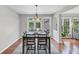 Cozy dining area with hardwood floors, seating for six, and access to an outdoor space at 1487 Monarch Ct, Marietta, GA 30062