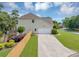 Back exterior of home with a two-car garage and wooden privacy fence at 1487 Monarch Ct, Marietta, GA 30062