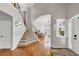 Bright entryway with staircase, hardwood floors, and an open living area at 1487 Monarch Ct, Marietta, GA 30062
