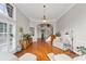Open living room with hardwood floors, neutral decor, and a staircase leading to the second floor at 1487 Monarch Ct, Marietta, GA 30062