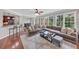 Spacious living room with hardwood floors, comfortable seating, and an adjacent dining area at 1487 Monarch Ct, Marietta, GA 30062