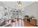 Bright living room with a bay window, hardwood floors, and modern lighting fixtures at 1487 Monarch Ct, Marietta, GA 30062