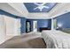 Bright main bedroom featuring an ensuite bathroom entrance, blue walls, and ample closet space at 1487 Monarch Ct, Marietta, GA 30062