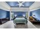 Main bedroom showcases a cozy chaise lounge, ceiling fan, and a calming blue color scheme at 1487 Monarch Ct, Marietta, GA 30062
