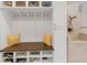 Mudroom features a built-in bench, storage cubbies, hooks, and a dog washing area at 1487 Monarch Ct, Marietta, GA 30062