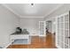 Home office with hardwood floors, and large desk, and a staircase visible at 1487 Monarch Ct, Marietta, GA 30062