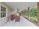 Covered porch with comfortable seating and ceiling fan, providing a relaxing outdoor living space at 1487 Monarch Ct, Marietta, GA 30062