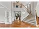 Open staircase with wood and carpet steps and views of living room at 1487 Monarch Ct, Marietta, GA 30062