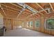 Unfinished basement ready to be customized with exposed beams and natural light from the windows at 3735 Hazel Ave, Cumming, GA 30040