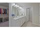 Bright bathroom with double vanity, plenty of storage, and access to a spacious walk-in closet at 3735 Hazel Ave, Cumming, GA 30040